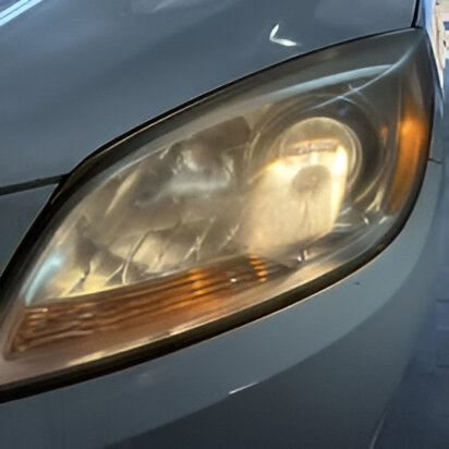 white 2015 Buick Verano headlight restoration after